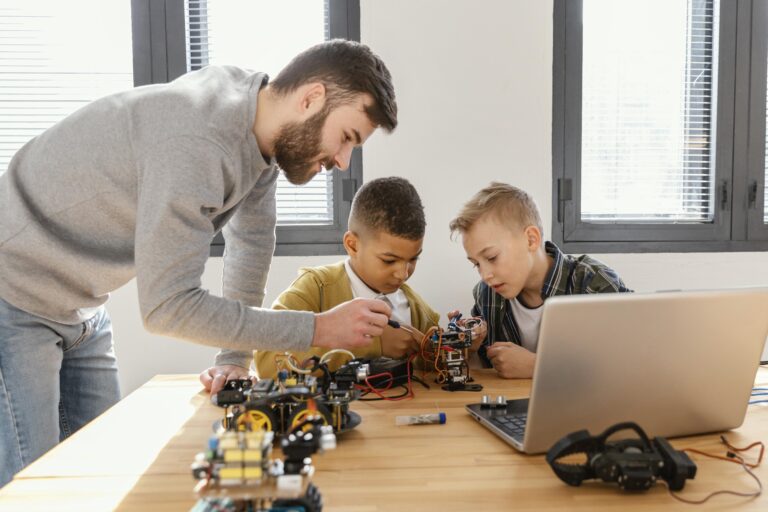 father sons making robot